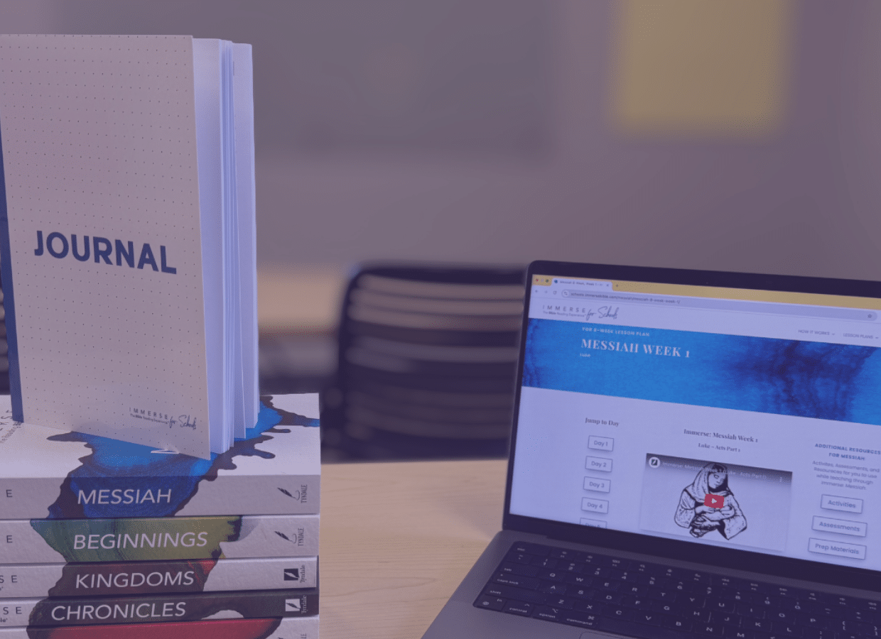 A stack of four books titled “MESSIAH,” “BEGINNINGS,” “KINGDOMS,” and “CHRONICLES” supports a “JOURNAL” next to an open laptop displaying an educational website.